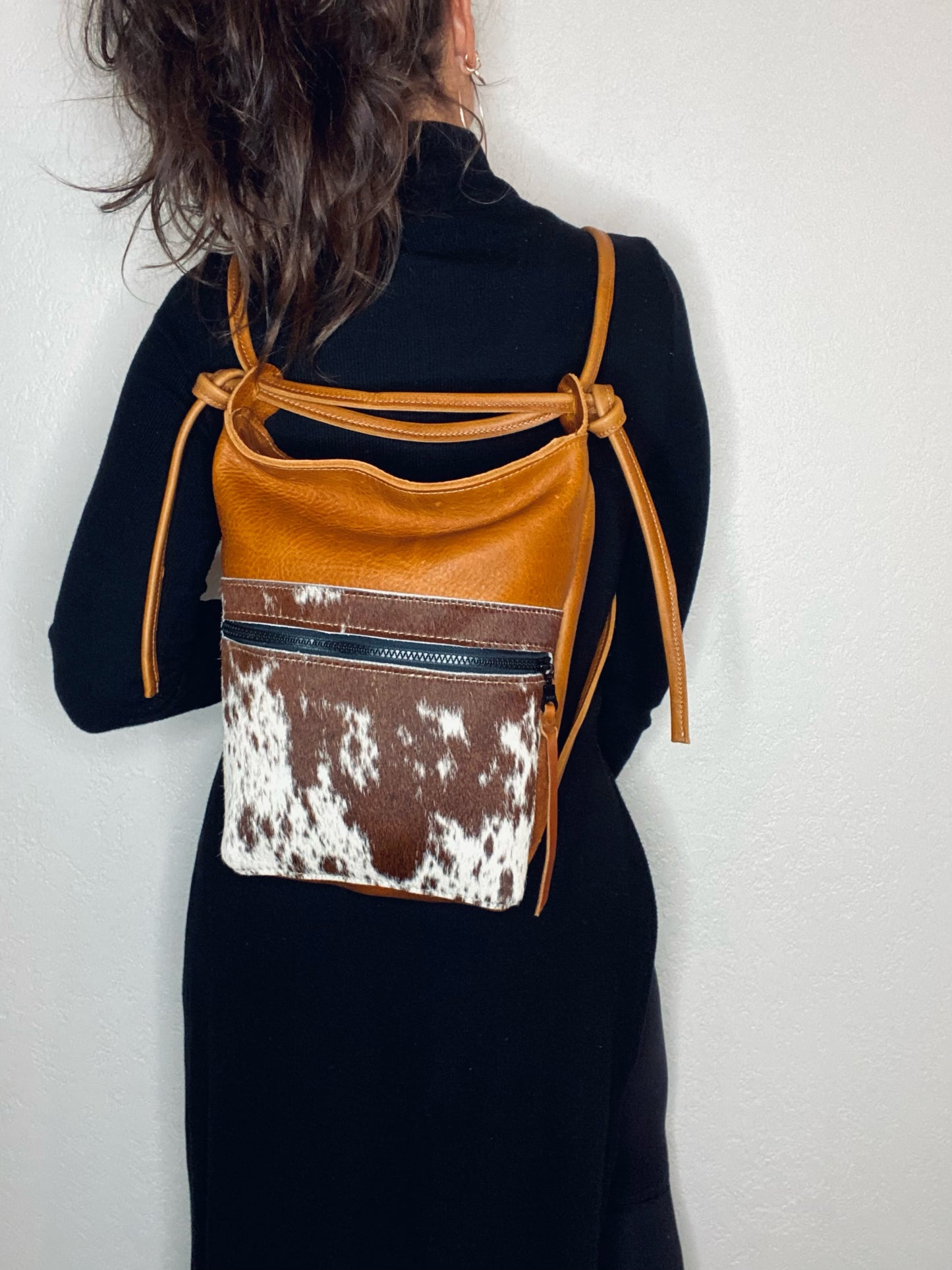 The Jack Bag in Rustic Whisky Oiltan Leather With Speckled Brown and White Hair on Hide Front Pocket